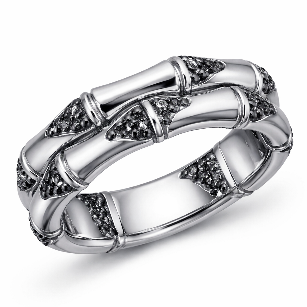 For men with black diamonds The Bamboo ring translates the lightness and resilience associated with bamboo into a continuous, sculptural design. Crafted in 18k white gold, diamonds are placed with intention throughout the piece, enhancing its graphic character and refined sense of precision.