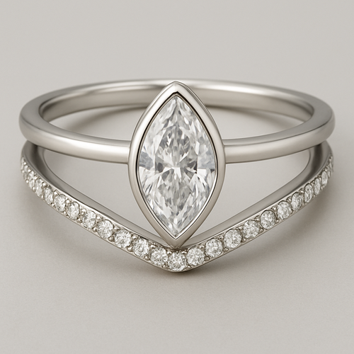 Create an engagement ring with a pave band but add a plain band to both sides. Let the plain bands create a floating split shank above the pave band that holds a marquise cut diamond in a north and south bezel. No prongs.