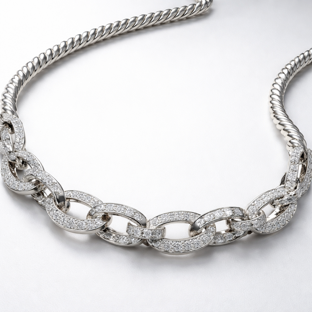A flexible necklace which is not rigid and inspired by a twisted round wire and it has links that connected the meduim pieces with eachothe and it has diamondr