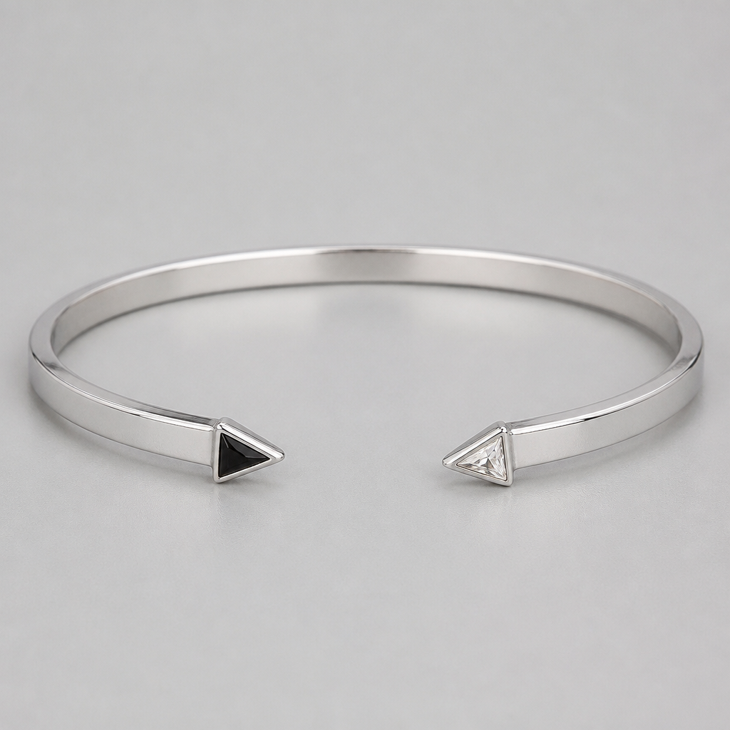 A women's bracelet made of silver. 2mm thickness 4.5mm width cuff both ends are pointy one with a triangle black stone and the other clear stone the stones are flat inside the cuff meaning ot cant be bigger than the cuff and they are pointing out
photorealistic jewelry design, A women's bracelet made of silver. 2mm thickness 4.5mm width cuff both ends are pointy one with a triangle black stone and the other clear stone the stones are flat inside the cuff meaning ot cant be bigger than the cuff and they are pointing out, modern style, just the design no text