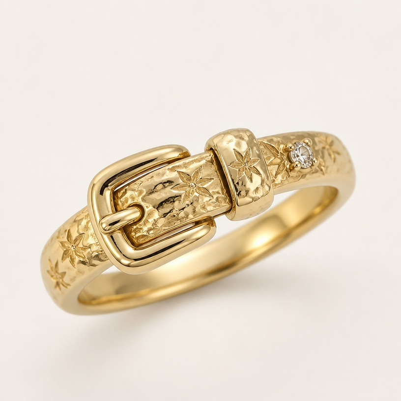 A women's ring made of gold. Use this image to make a buckle ring. Use the image for the engraved design on the gold band
using the attached image as a visual reference, create A women's ring made of gold. Use this image to make a buckle ring. Use the image for the engraved design on the gold band. photorealistic, just the design no text