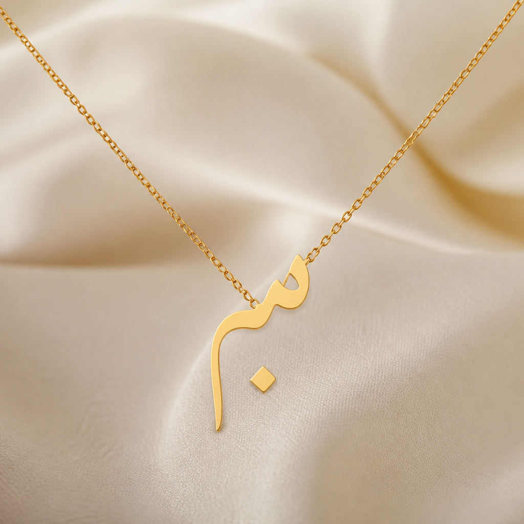 A minimalist women's pendant made of gold suitable for formal. should be thin flat initial of meem (urdu) initial
photorealistic jewelry design, A minimalist women's pendant made of gold suitable for formal. should be thin flat initial of meem (urdu) initial, minimalist style, just the design no text