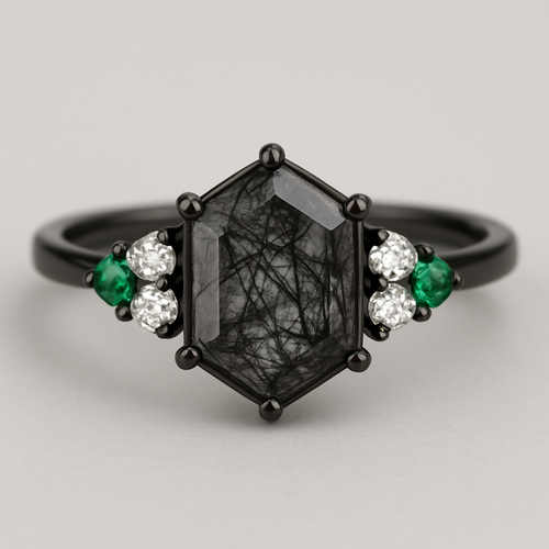 Skinny Hexagon cut Black rutilated quartz with 1 emerald on each side and 2 moissanite on each side accent stones in a cluster on a black band