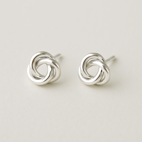 "Love's Knot" Stud Earrings: Elegant sterling silver stud earrings in the shape of a perfectly formed, simple love knot. No stones, just the beautiful, symbolic intertwining of silver.