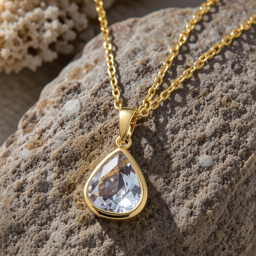 Gold chain pendant with a rock crystal pendant