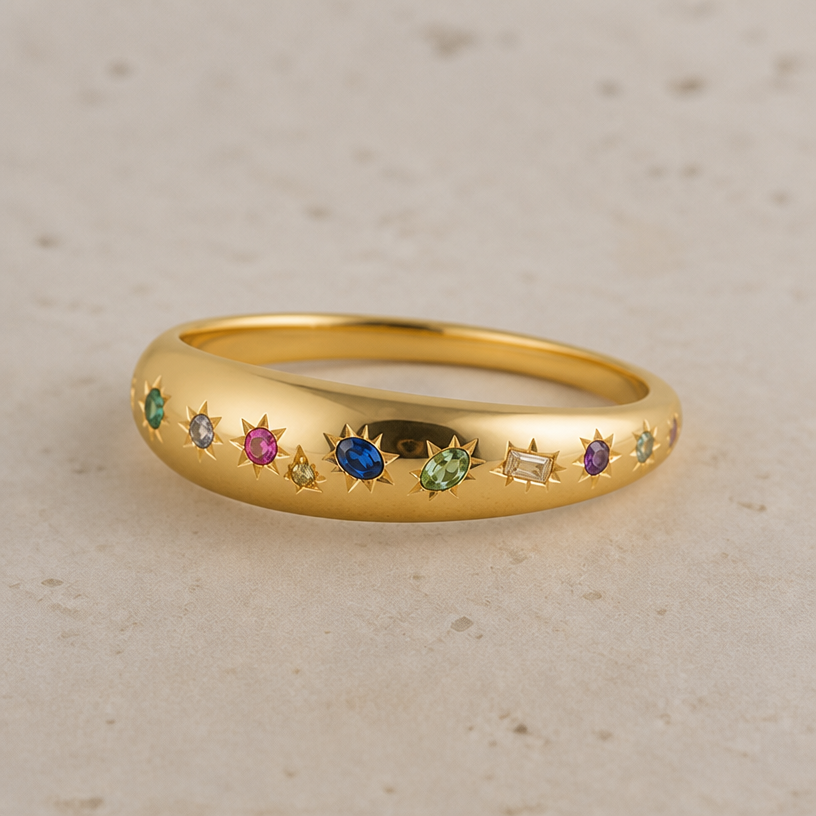 More wide and rounded in the front and then tapering off to skinny towards the back. Like a dome ring but still not super wide altogether
edit the attached jewelry design with these instructions: More wide and rounded in the front and then tapering off to skinny towards the back. Like a dome ring but still not super wide altogether. keep it photorealistic, just the design no text