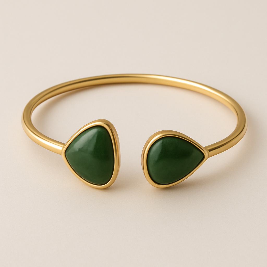 Create a 14k yellow gold bangle with two large pear shaped nephrite jade set in them