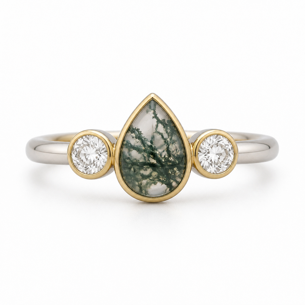 Trilogy ring
10x7mm pear shape moss Agate
Two x 5mm Round diamonds
Collets white gold
Band yellow gold
photorealistic jewelry design, just the design, no text, White gold and yellow gold Trilogy ring with a 10x7mm pear shape moss Agate and two 5mm Round diamonds, collet set.