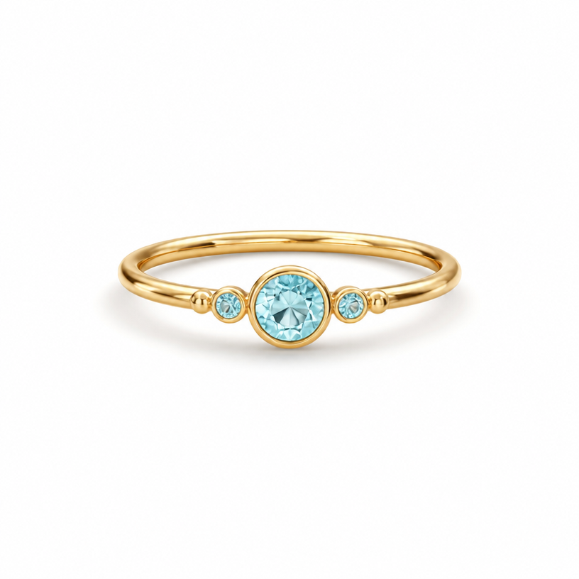 A minimalist women's ring made of gold with aquamarine stones suitable for gift
using the attached image as a visual reference, create A minimalist women's ring made of gold with aquamarine stones suitable for gift. photorealistic, just the design no text