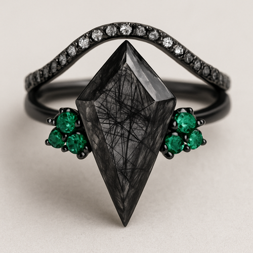 Black band, long kite cut rutilated black quartz, emerald accent stones 3 on each side in a cluster, add a wedding band that curves around the top of the main stone with black and white stones