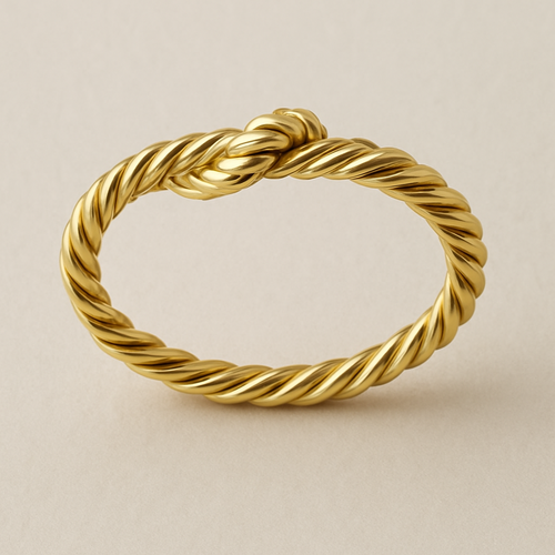 Yellow gold ring made to look like a piece of twine wrapped like a ring 