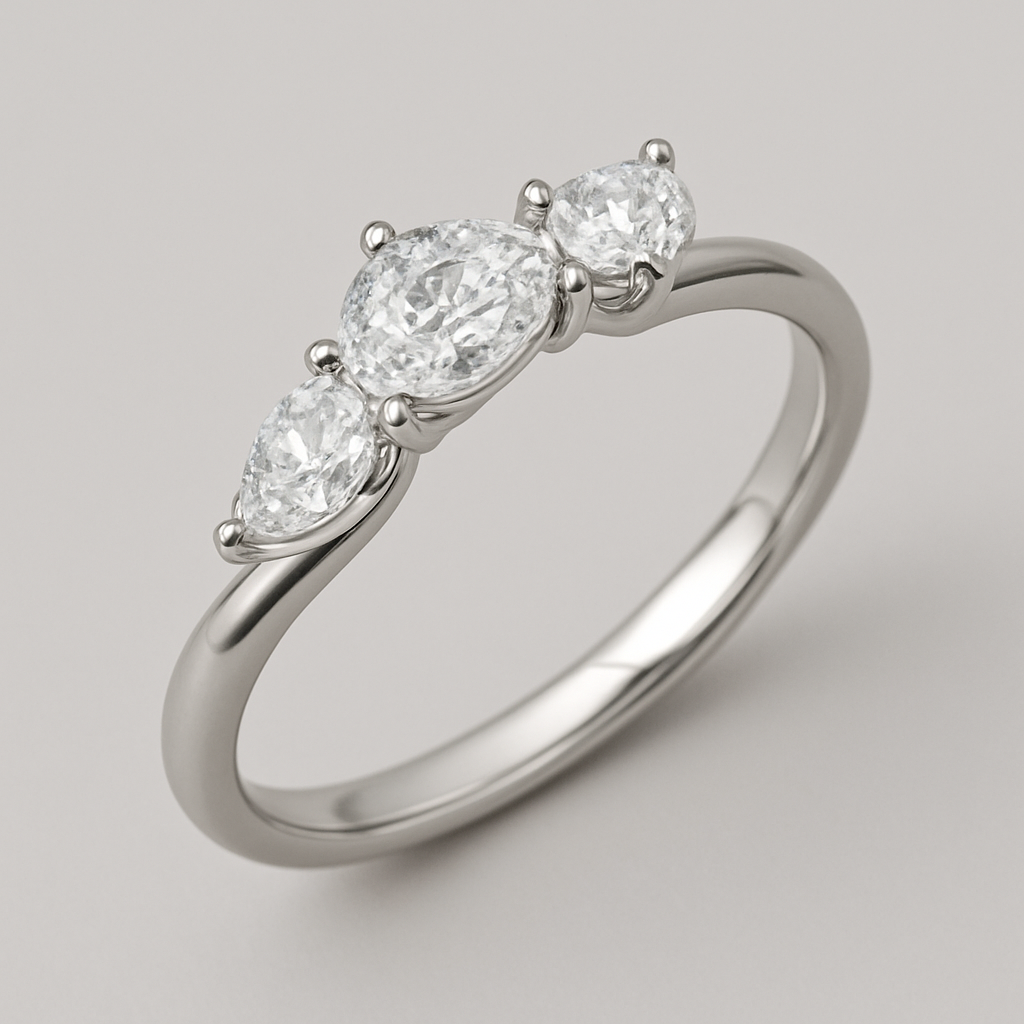 Toi te moir ring, curved band, pear shaped diamonds. Not big but not small in size