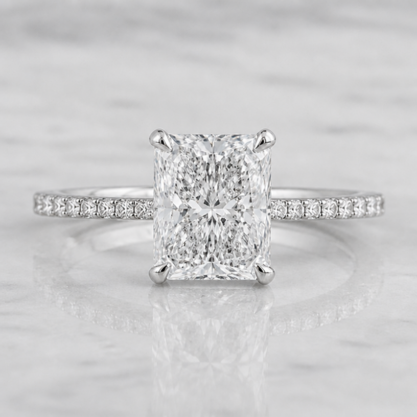The diamonds on the band are smaller and less round
edit the attached jewelry design with these instructions: The diamonds on the band are smaller and less round. keep it photorealistic, just the design no text