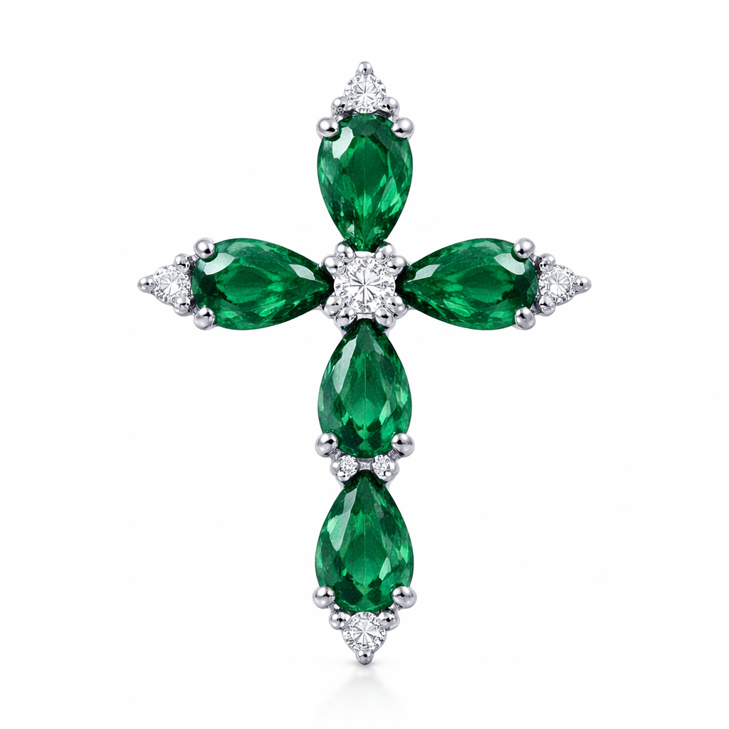 Pear cut emerald cross on 14k white gold with bale attached to the back and not shown. 5 diamond accent stones
