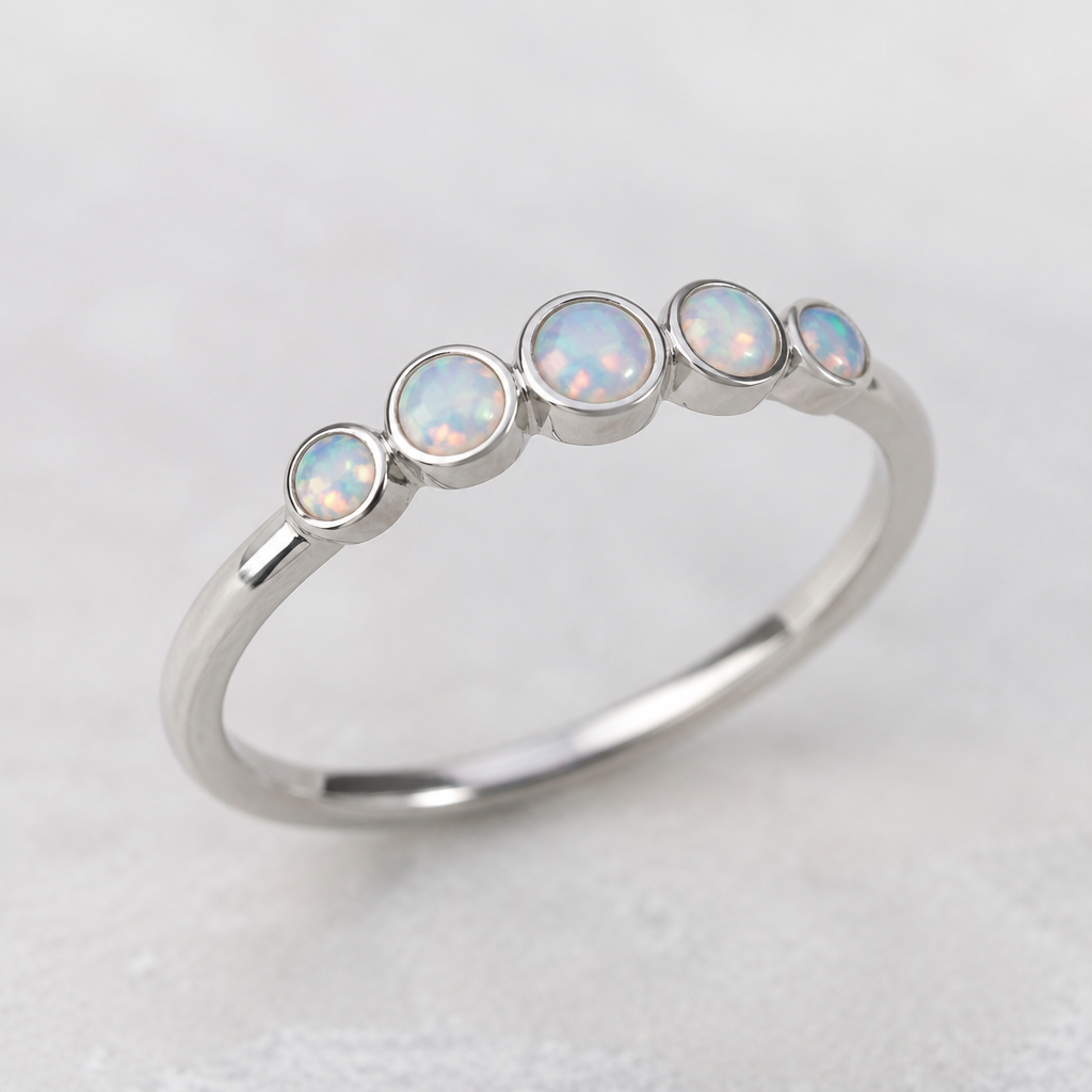 A women's ring made of silver, ultra-minimalist, very simple and clean, understated, no embellishments. multiple 2mm flat bottom opals in bezel settings
photorealistic jewelry design, A women's ring made of silver, ultra-minimalist, very simple and clean, understated, no embellishments. multiple 2mm flat bottom opals in bezel settings, modern style, just the design no text