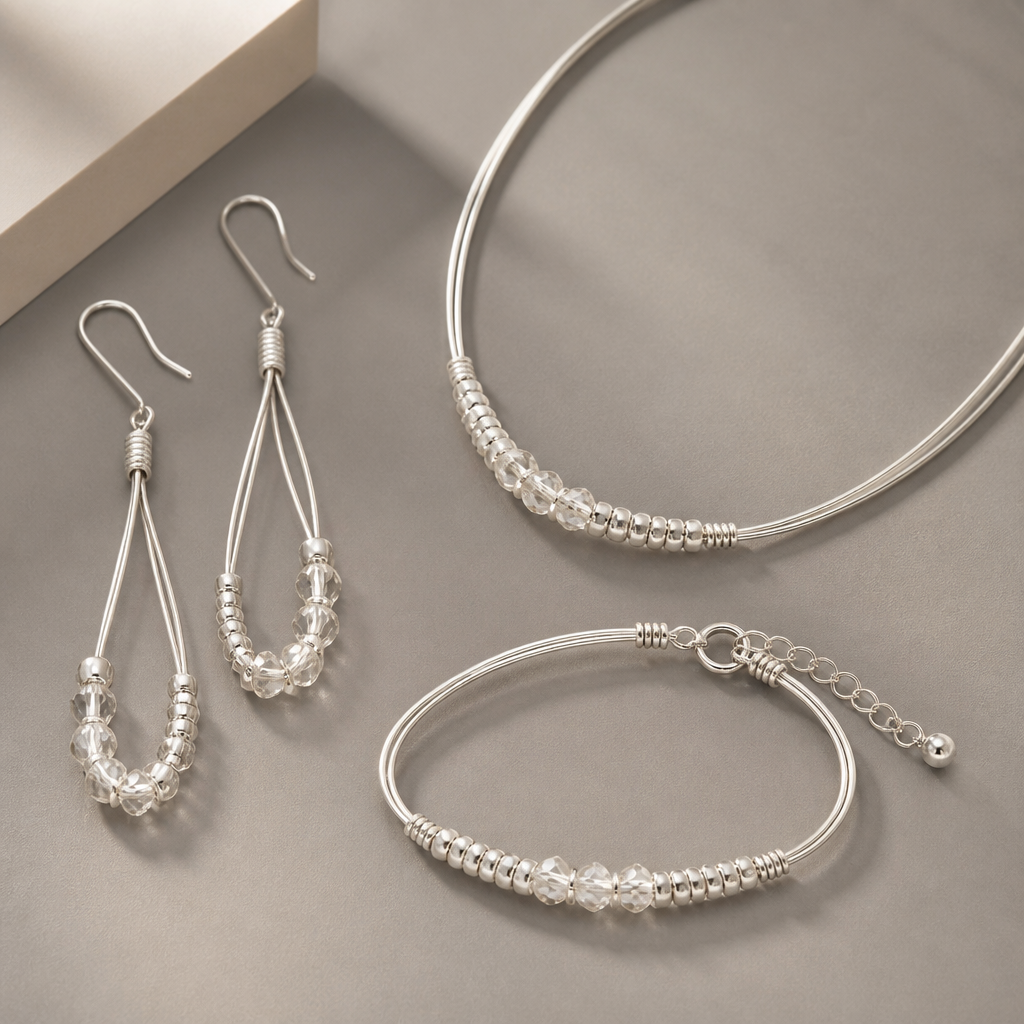 A statement women's earrings made of silver suitable for daily wear, minimalist, simple and delicate, clean lines. made from wire, seed beads and crystal beads a set of earrings with matching bracelet and necklace
photorealistic jewelry design, A statement women's earrings made of silver suitable for daily wear, minimalist, simple and delicate, clean lines. made from wire, seed beads and crystal beads a set of earrings with matching bracelet and necklace, statement style, just the design no text