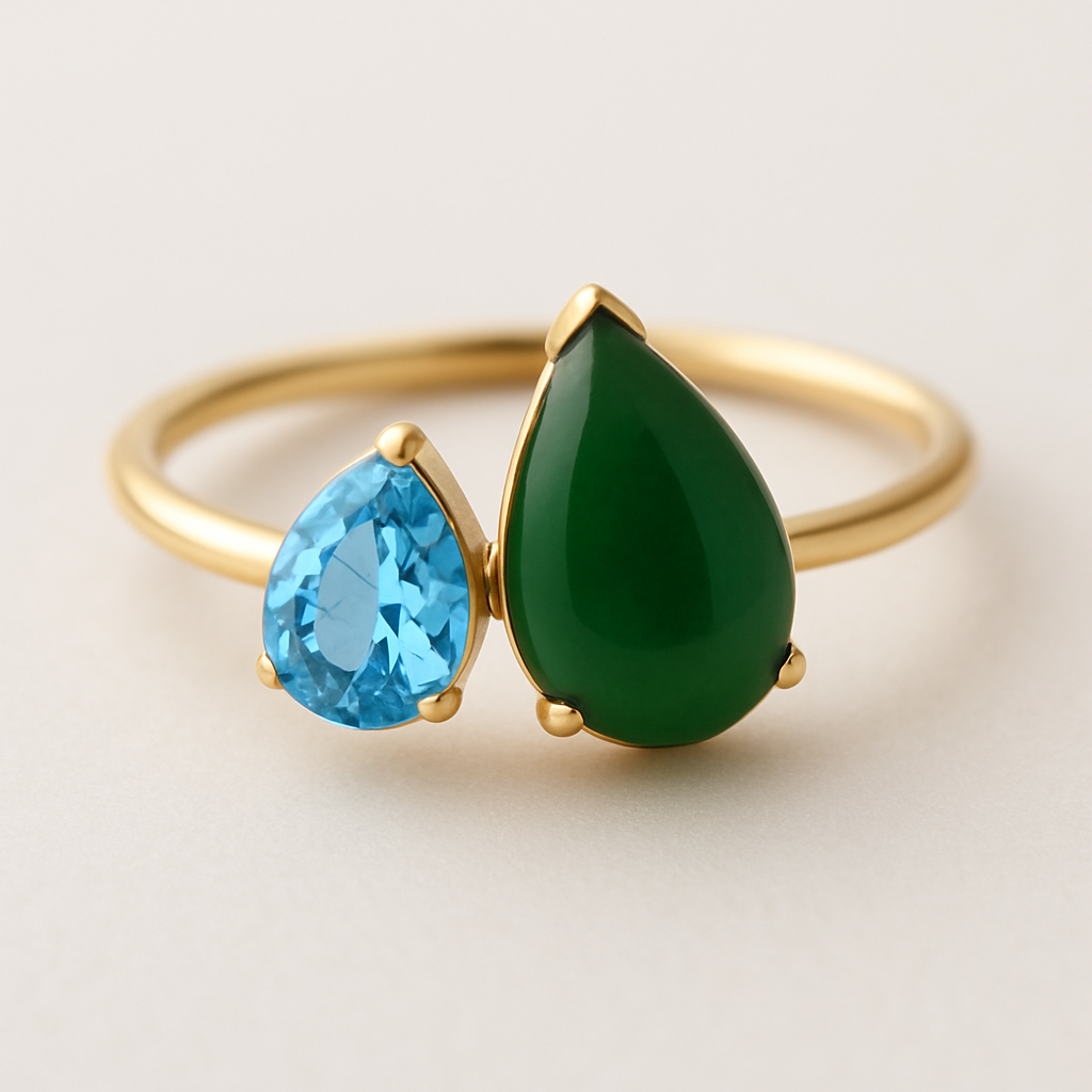 Toi et Moi Ring with a small pear shaped blue topaz and a slightly larger pear shaped nephrite jade stone