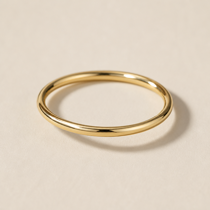 A minimalist women's ring made of gold
using the attached image as a visual reference, create A minimalist women's ring made of gold. photorealistic, just the design no text