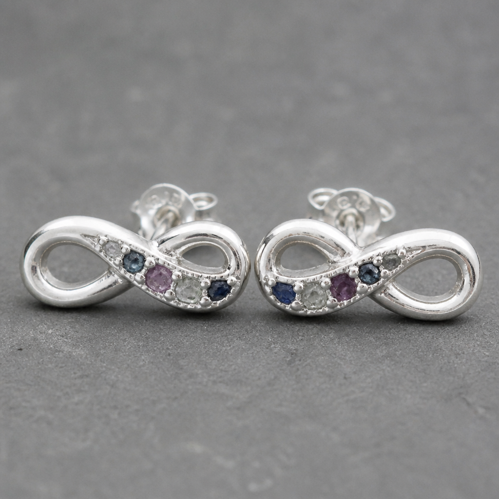 A infinity women's earrings made of silver suitable for daily wear. create earing with theses 5 pices rough color sapphires. with using a silver clay
photorealistic jewelry design, A infinity women's earrings made of silver suitable for daily wear. create earing with theses 5 pices rough color sapphires. with using a silver clay, infinity style, just the design no text