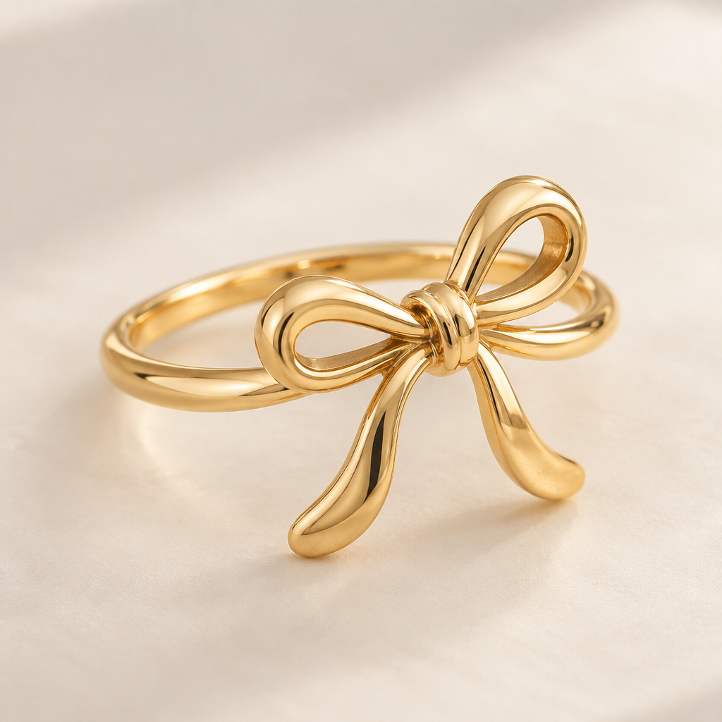 A minimalist women's ring made of gold suitable for gift, detailed and decorative, moderately ornate. ring with the aesthetic ribbon design and the ribbon is tilting to right a bit.
the ring goes around the ribbon not under the ribbon.
the ribbon is tied like a single knot and the ribbon has two same size loops.
the ribbon is rounded design not flat.
both of the ribbon tails is a little bit bendy one to the right and the other to the left.
photorealistic jewelry design, A minimalist women's ring made of gold suitable for gift, detailed and decorative, moderately ornate. ring with the aesthetic ribbon design and the ribbon is tilting to right a bit.
the ring goes around the ribbon not under the ribbon.
the ribbon is tied like a single knot and the ribbon has two same size loops.
the ribbon is rounded design not flat.
both of the ribbon tails is a little bit bendy one to the right and the other to the left., minimalist style, just the design no text
