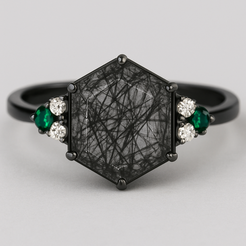 Skinny medium length Hexagon cut Black rutilated quartz with 1 emerald on each side and 2 moissanite on each side accent stones in a cluster on a black band