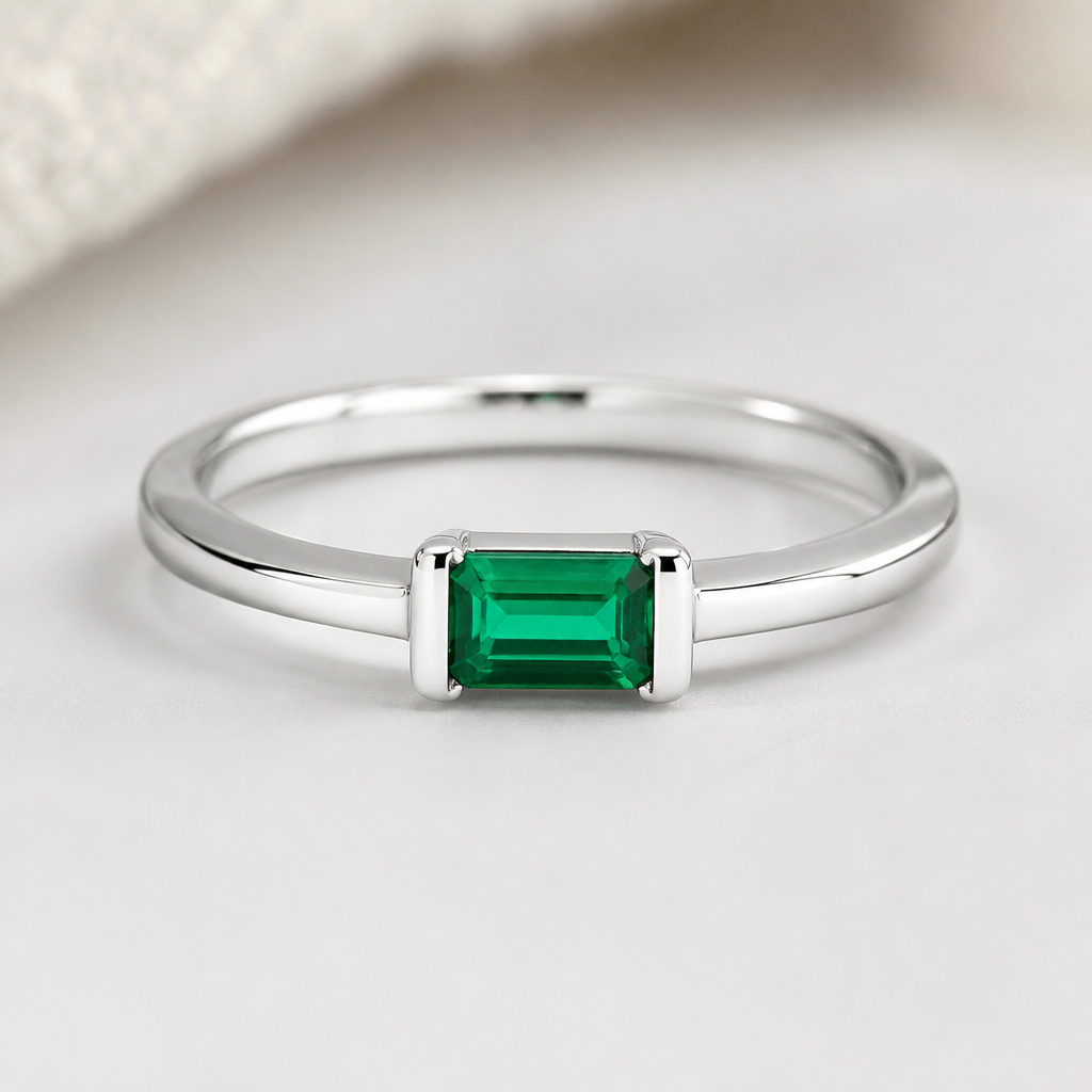 A women's ring made of silver with emerald stones, minimalist, simple and delicate, clean lines. I have a rectangular emerald
photorealistic jewelry design, A women's ring made of silver with emerald stones, minimalist, simple and delicate, clean lines. I have a rectangular emerald, modern style, just the design no text