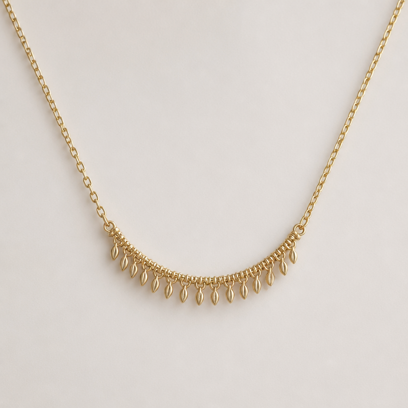 A nature women's necklace made of gold, minimalist, simple and delicate, clean lines. daintier version of this
using the attached image as a visual reference, create A nature women's necklace made of gold, minimalist, simple and delicate, clean lines. daintier version of this. photorealistic, just the design no text