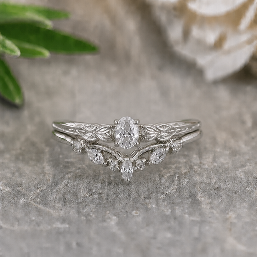 Make the main stone of the upper ring less pointy
edit the attached jewelry design with these instructions: Make the main stone of the upper ring less pointy. keep it photorealistic, just the design no text