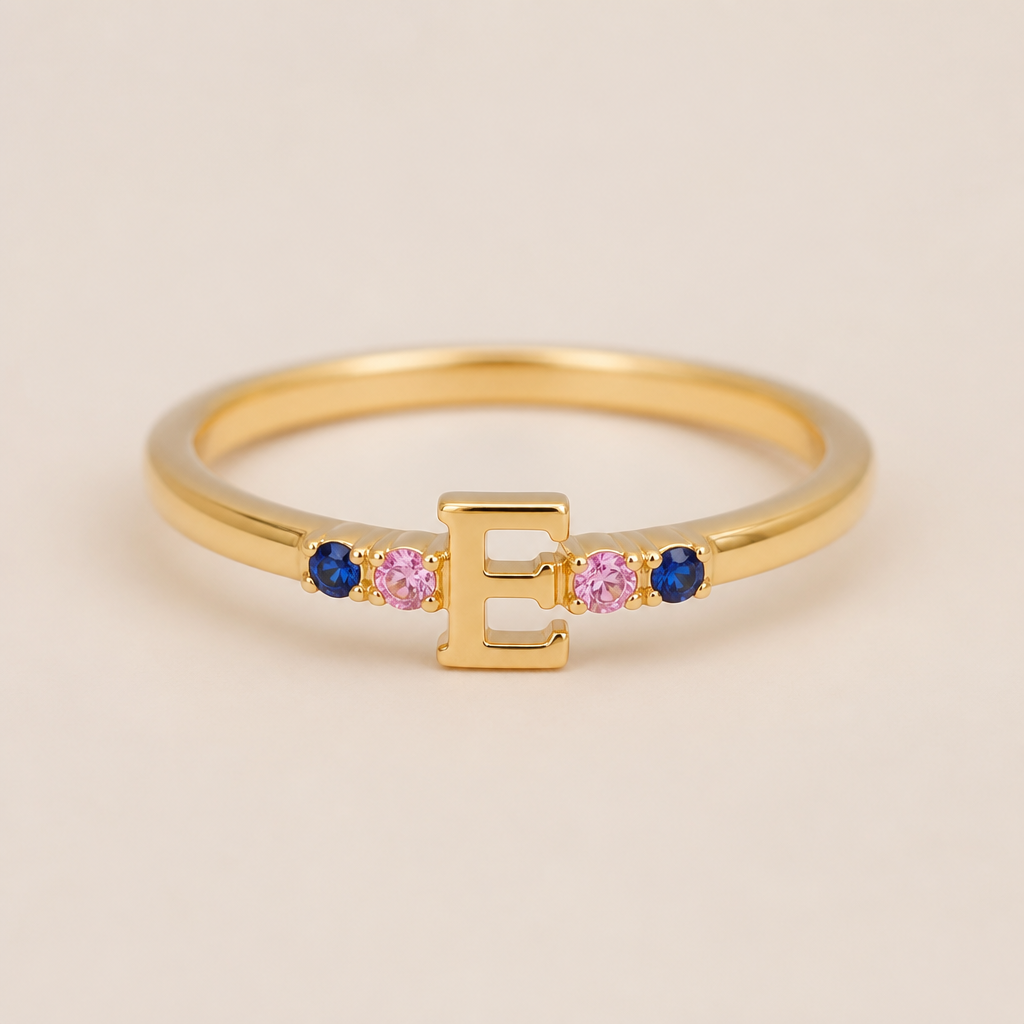 A minimalist women's ring, ultra-minimalist, very simple and clean, understated, no embellishments. um anel de 15 anos na cor dourada com inicial E com pedrinhas azul e pedrinhas rosa em volta
photorealistic jewelry design, A minimalist women's ring, ultra-minimalist, very simple and clean, understated, no embellishments. um anel de 15 anos na cor dourada com inicial E com pedrinhas azul e pedrinhas rosa em volta, minimalist style, just the design no text