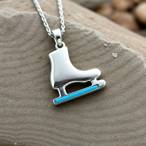 Silver Pendant shape one ice skate with turquoise stripe inside the low thin part blade
