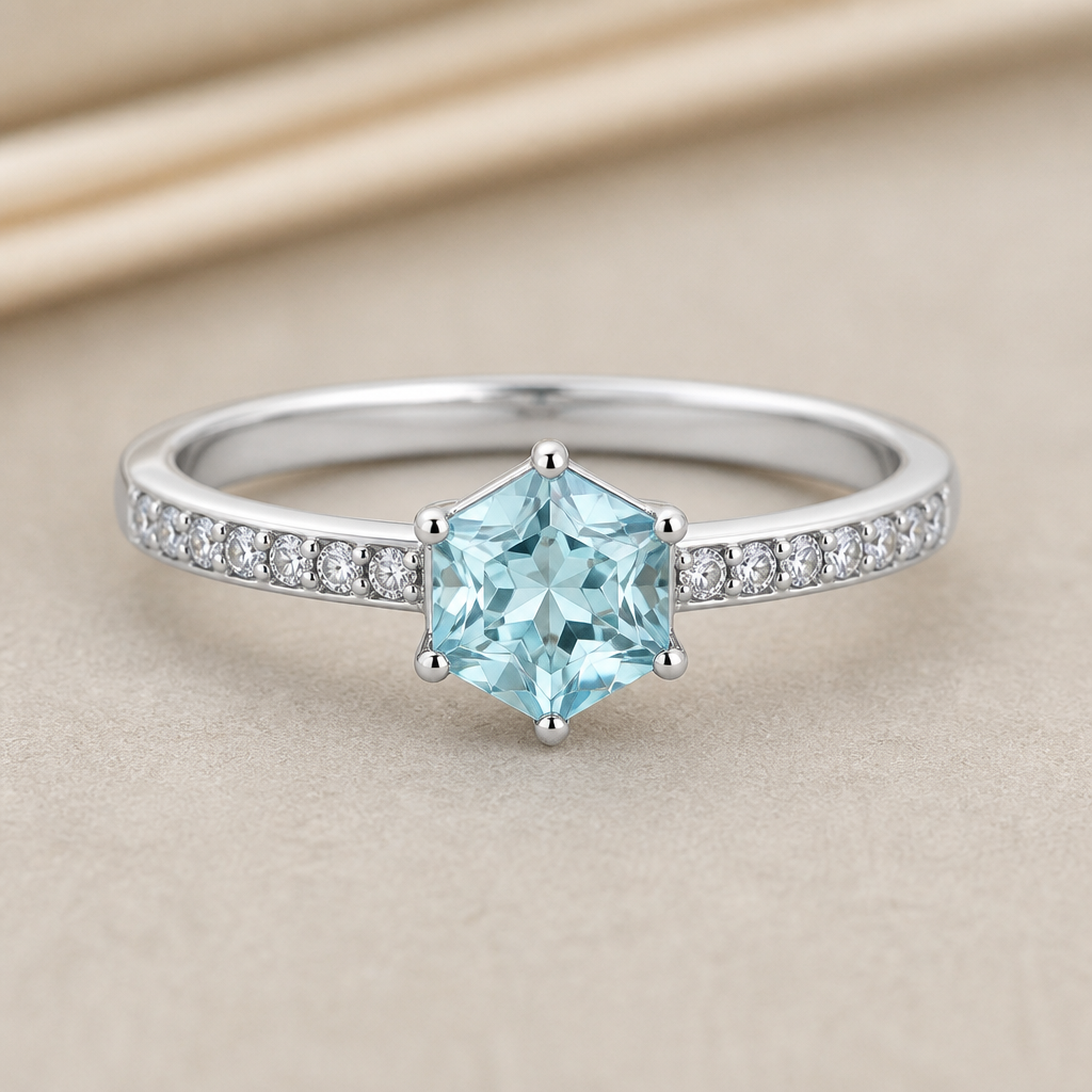 A modern women's ring. A ring made of sterling silver with a hexagonal light turquoise cubic zirconia stone in the center, and small white cubic zirconia stones on the ring band. اسواره
photorealistic jewelry design, A modern women's ring. A ring made of sterling silver with a hexagonal light turquoise cubic zirconia stone in the center, and small white cubic zirconia stones on the ring band. اسواره, modern style, just the design no text