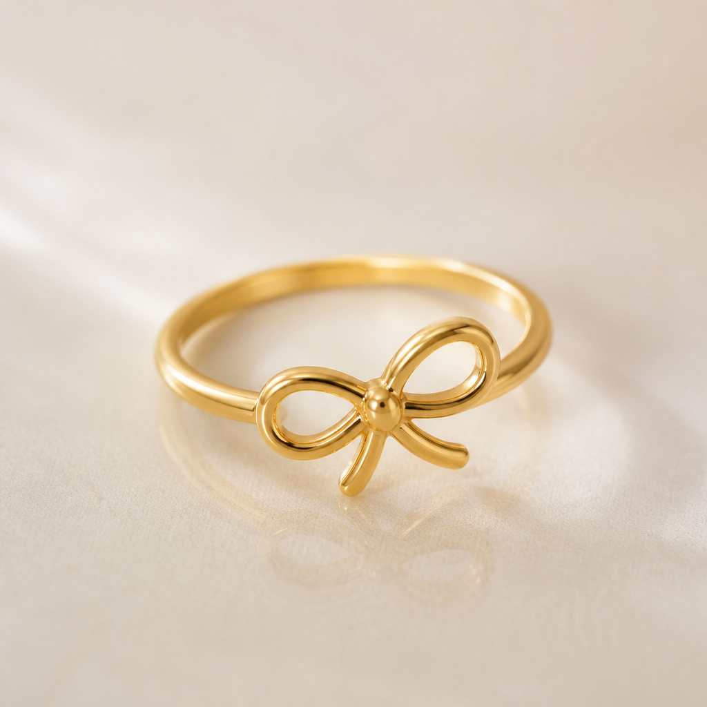 A minimalist women's ring made of gold suitable for party. the ribbon design that tilted a little bit to the right and the ribbon design is very simple not to crowded design . between the loops inside the ribbon is empty. THE RING is GO AROUND THE RIBBON NOT ON TOP of the ring. the ribbon is more round and the tail of the ribbon is a little bit short . the ribbon is tie like a ribbon
photorealistic jewelry design, A minimalist women's ring made of gold suitable for party. the ribbon design that tilted a little bit to the right and the ribbon design is very simple not to crowded design . between the loops inside the ribbon is empty. THE RING is GO AROUND THE RIBBON NOT ON TOP of the ring. the ribbon is more round and the tail of the ribbon is a little bit short . the ribbon is tie like a ribbon, minimalist style, just the design no text
