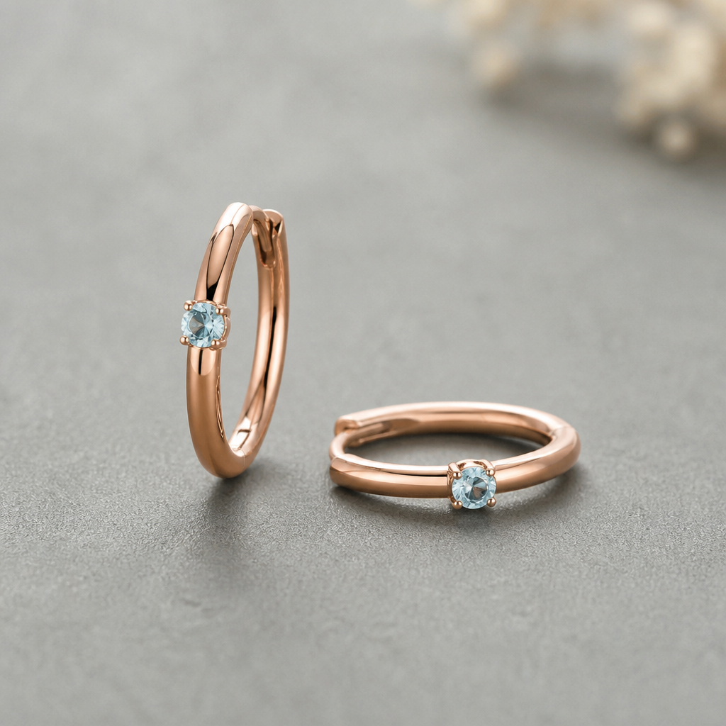 A minimalist women's earrings made of rose gold with aquamarine stones suitable for daily wear. a minimal and regular wear pair of hoop helix earring
photorealistic jewelry design, A minimalist women's earrings made of rose gold with aquamarine stones suitable for daily wear. a minimal and regular wear pair of hoop helix earring, minimalist style, just the design no text