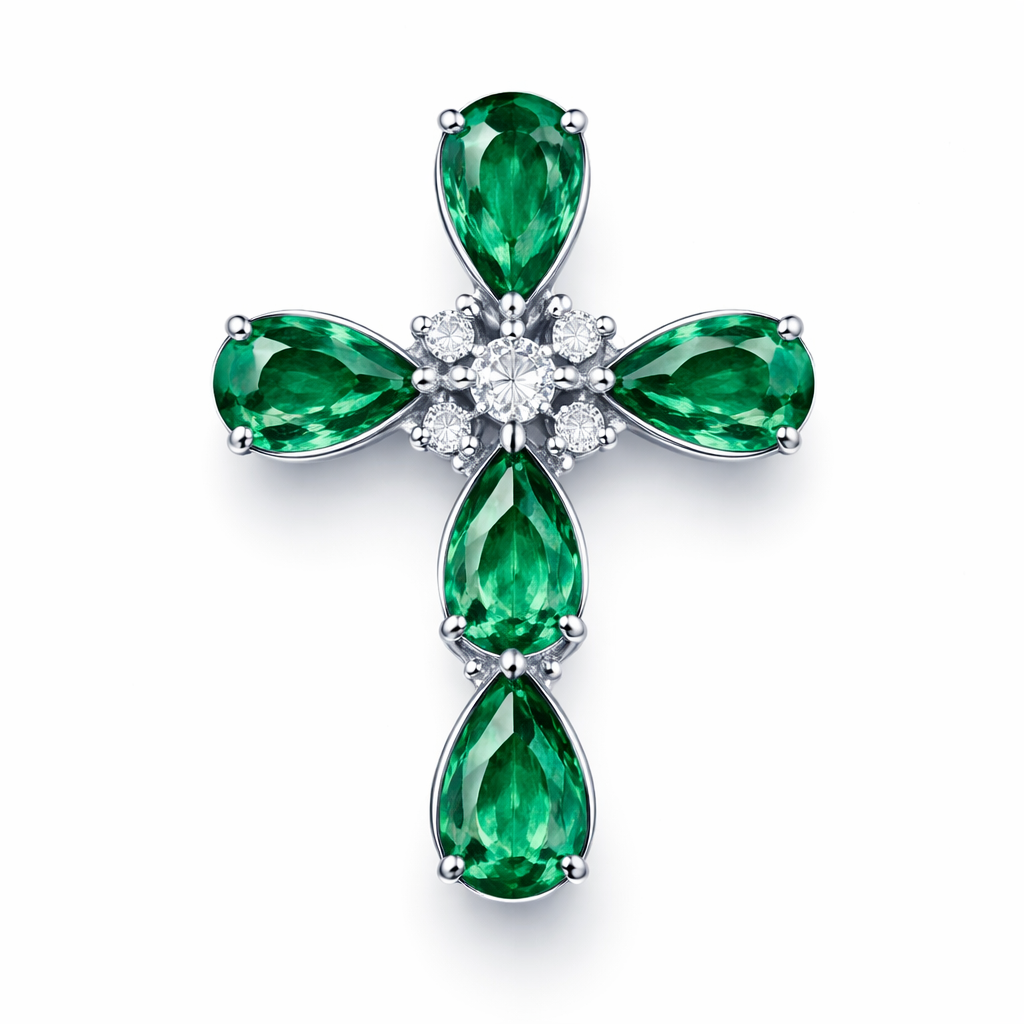 Pear cut Emerald white gold cross and with simple diamond accent stones. Timeless, elegant, and classy. Hidden bail. Light metal work. No double prongs