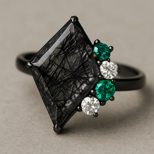 Kite cut Black rutilated quartz with emerald and moissanite accent stones in a cluster on a black band
