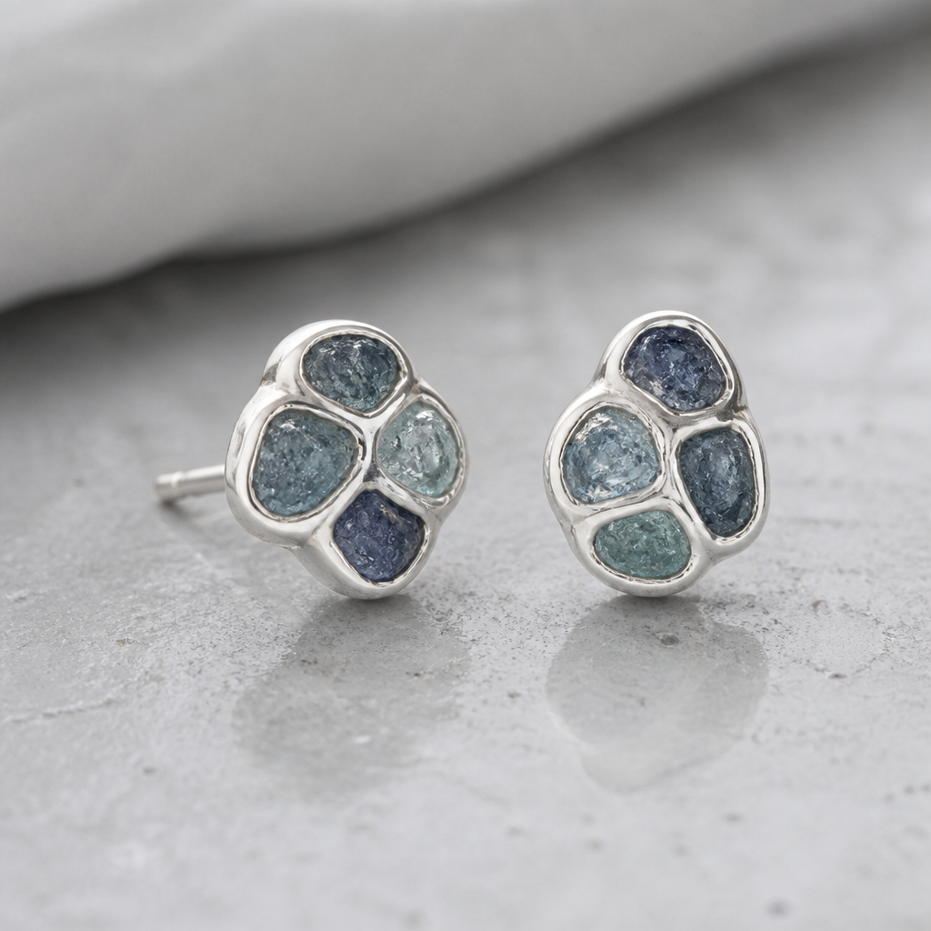 A minimalist women's earrings made of silver suitable for daily wear. create earing with theses 5 pices rough color sapphires. with using a silver clay
photorealistic jewelry design, A minimalist women's earrings made of silver suitable for daily wear. create earing with theses 5 pices rough color sapphires. with using a silver clay, minimalist style, just the design no text