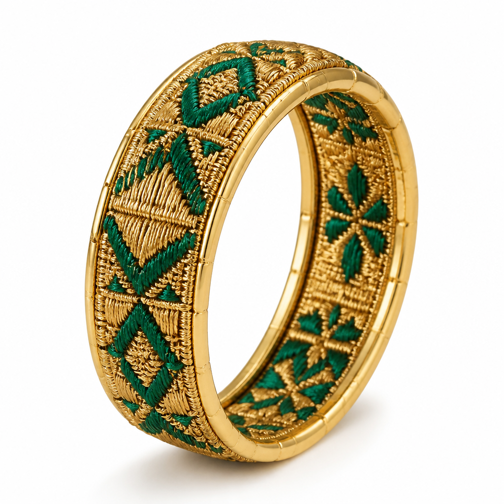 A women's ring. A unique luxury high jewelry ring inspired by authentic Balochi embroidery. The ring band itself is made from traditional Balochi embroidered fabric, wrapping completely around the finger as a full circular ring. The fabric is the main body of the ring, not a decoration placed on top.
The embroidered fabric is carefully enclosed and framed by a thin elegant 18k yellow gold structure surrounding the entire ring. The gold frame continues underneath the fabric as a strong and refined support base. The gold should look handcrafted, polished, luxurious and high quality.
The Balochi embroidery pattern contains only two colors: rich metallic gold thread and deep emerald green details. No other colors. The combination of golden embroidery and emerald green creates a royal Persian luxury feeling.
Persian heritage meets modern international high jewelry design. Elegant minimalist style, sophisticated craftsmanship, unique artistic concept for a luxury jewelry brand. Ultra realistic jewelry photography, macro close-up, realistic gold texture, detailed fabric embroidery, premium product presentation, white background, studio lighting.
No gemstones, no diamonds, no extra decorations, no colorful patterns. Focus only on the beauty of Balochi embroidered fabric, emerald green and gold colors, and the 18k yellow gold frame.
photorealistic jewelry design, A women's ring. A unique luxury high jewelry ring inspired by authentic Balochi embroidery. The ring band itself is made from traditional Balochi embroidered fabric, wrapping completely around the finger as a full circular ring. The fabric is the main body of the ring, not a decoration placed on top.
The embroidered fabric is carefully enclosed and framed by a thin elegant 18k yellow gold structure surrounding the entire ring. The gold frame continues underneath the fabric as a strong and refined support base. The gold should look handcrafted, polished, luxurious and high quality.
The Balochi embroidery pattern contains only two colors: rich metallic gold thread and deep emerald green details. No other colors. The combination of golden embroidery and emerald green creates a royal Persian luxury feeling.
Persian heritage meets modern international high jewelry design. Elegant minimalist style, sophisticated craftsmanship, unique artistic concept for a luxury jewelry brand. Ultra realistic jewelry photography, macro close-up, realistic gold texture, detailed fabric embroidery, premium product presentation, white background, studio lighting.
No gemstones, no diamonds, no extra decorations, no colorful patterns. Focus only on the beauty of Balochi embroidered fabric, emerald green and gold colors, and the 18k yellow gold frame., modern style, just the design no text