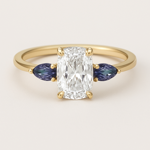2 carat elongated cushion cut diamond engagement ring with double claw prongs in yellow gold ring with marquise shaped alexandrite side stones 