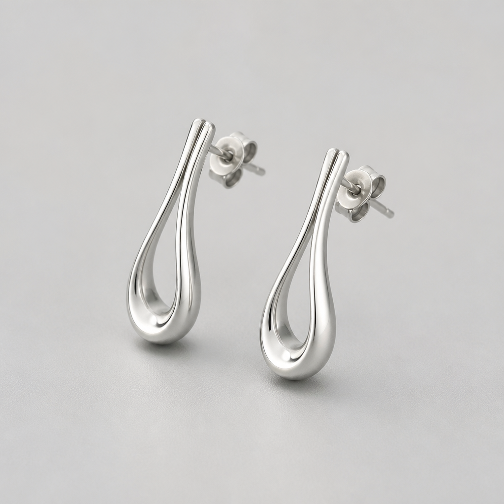 A women's earrings made of silver suitable for daily wear
photorealistic jewelry design, A women's earrings made of silver suitable for daily wear, modern style, just the design no text