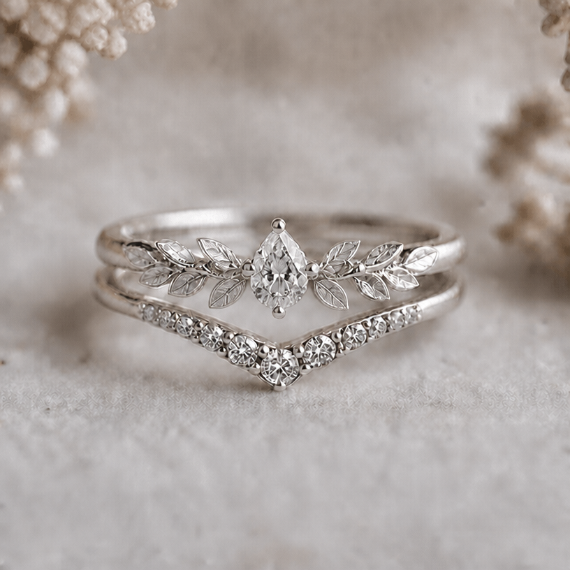 Add more petals next to the main stone to fill the space and make it more fitting with the lower ring
edit the attached jewelry design with these instructions: Add more petals next to the main stone to fill the space and make it more fitting with the lower ring. keep it photorealistic, just the design no text