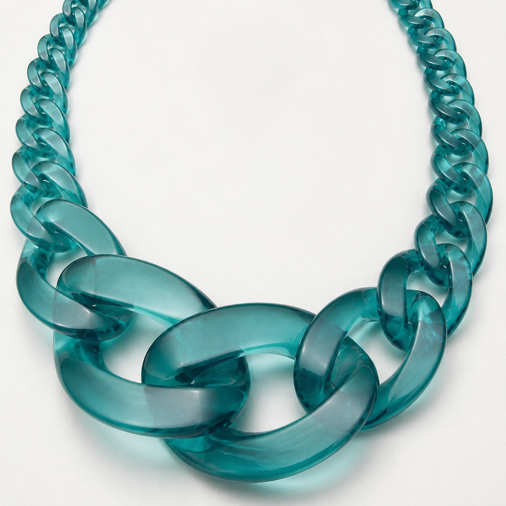 A women's necklace. create a chunky Cuban links style plastic necklace that is graduated and exaggerated in the first three links.translucent color teal
photorealistic jewelry design, A women's necklace. create a chunky Cuban links style plastic necklace that is graduated and exaggerated in the first three links.translucent color teal, modern style, just the design no text