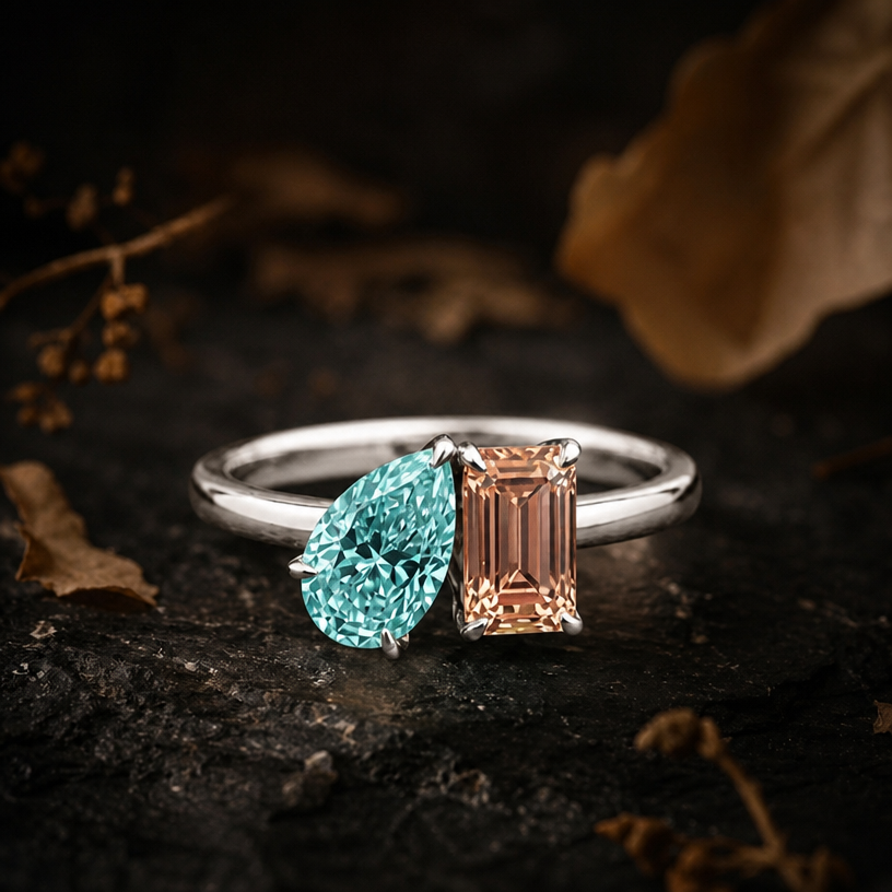 A minimalist women's ring made of silver suitable for wedding, detailed and decorative, moderately ornate. with Paraiba colour pear stone and parapadsha rectangular stone all in radiant cut
using the attached image as a visual reference, create A minimalist women's ring made of silver suitable for wedding, detailed and decorative, moderately ornate. with Paraiba colour pear stone and parapadsha rectangular stone all in radiant cut. photorealistic, just the design no text