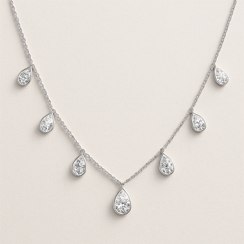 Pear shape pears station necklace 7 diamonds each diamonds .15 