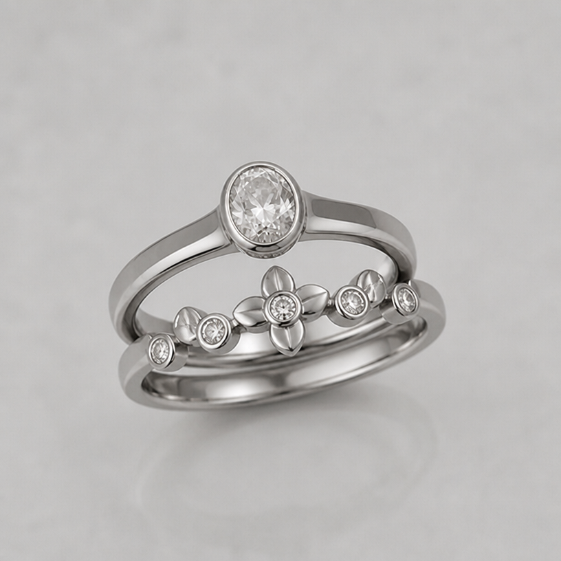 Band should match with a second ring which has floral petals and small stones
edit the attached jewelry design with these instructions: Band should match with a second ring which has floral petals and small stones. keep it photorealistic, just the design no text