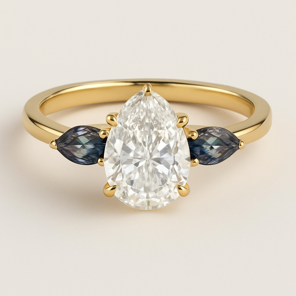 2 carat pear cut diamond engagement ring with double claw prongs in yellow gold ring with marquise shaped alexandrite side stones