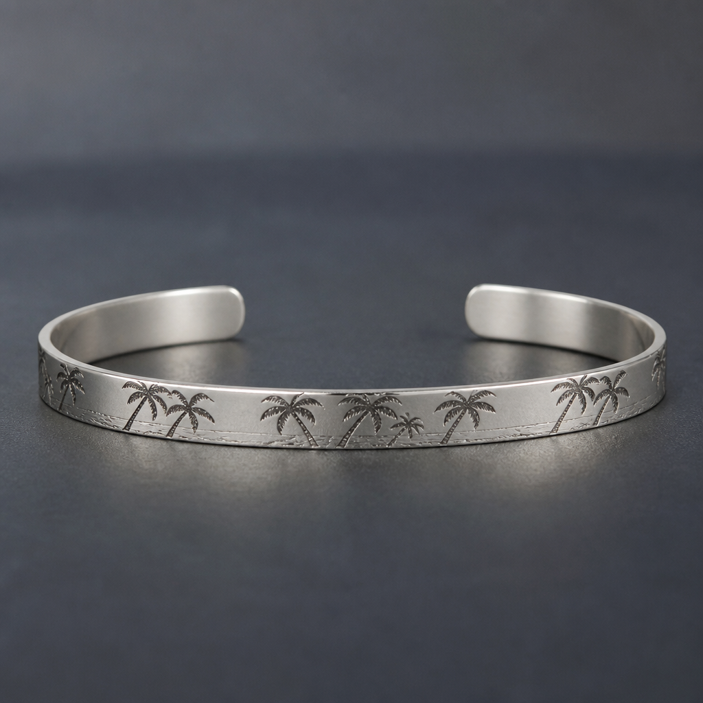 A men's bracelet made of silver. 2mm thickness 4.5mm witdh cuff with palm tree engraved sideways
photorealistic jewelry design, A men's bracelet made of silver. 2mm thickness 4.5mm witdh cuff with palm tree engraved sideways, modern style, just the design no text