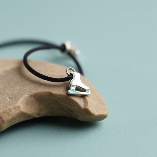 Bracelet black leather with silver ice skate and turquoise stripe inside the low thin part blade
