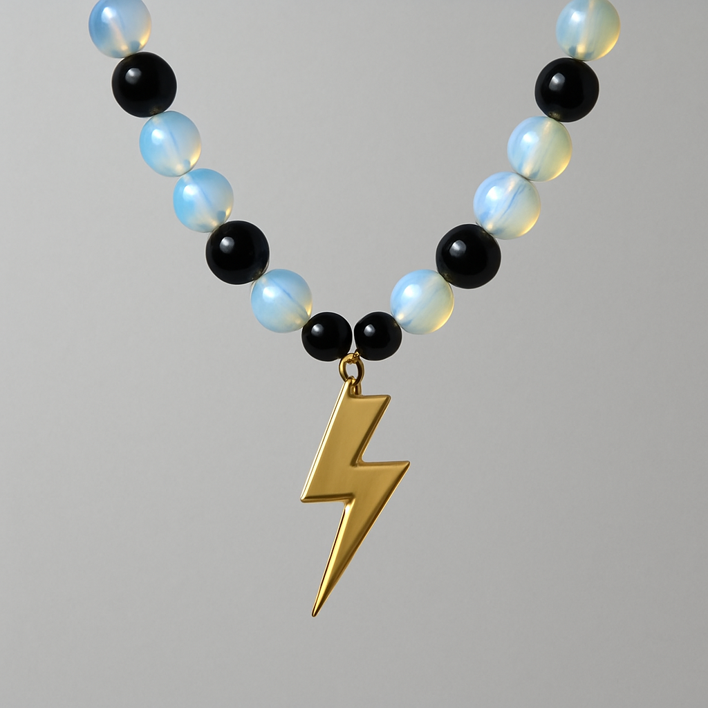 Opalite and onyx necklace with a gold lightening strike pendent