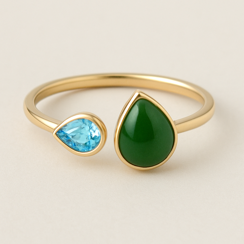 Toi et Moi Ring with a small pear shaped blue topaz and a slightly larger pear shaped nephrite jade stone