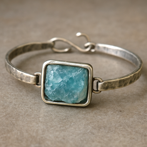 Handmade silver bracelet with raw aquamarine in a frame 